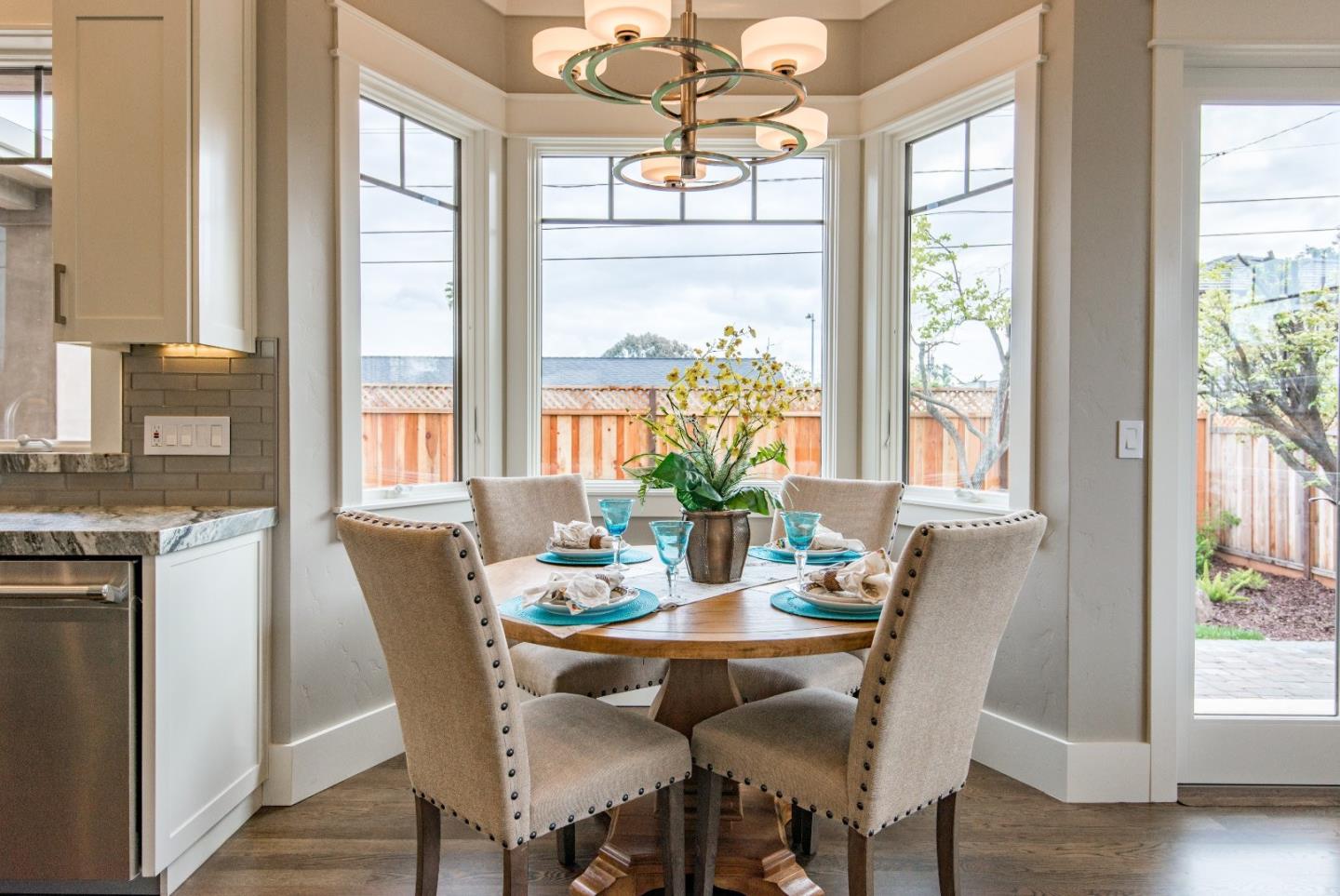 10416 Prune Tree Lane Cupertino, CA 95014 - Photo 6 of 21 a view of a dining room with furniture window and wooden floor