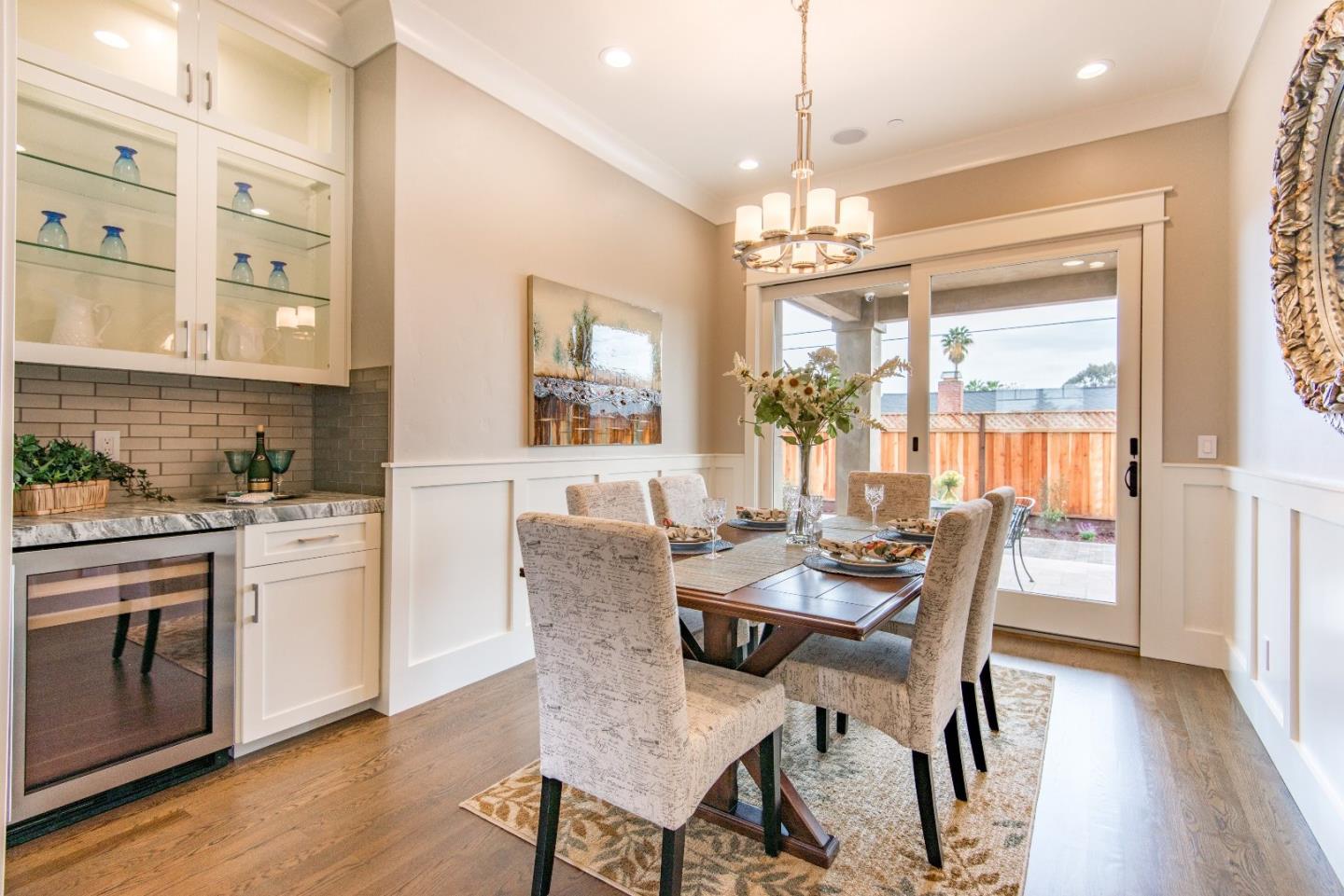 10416 Prune Tree Lane Cupertino, CA 95014 - Photo 7 of 21 a dining room with furniture a chandelier and wooden floor