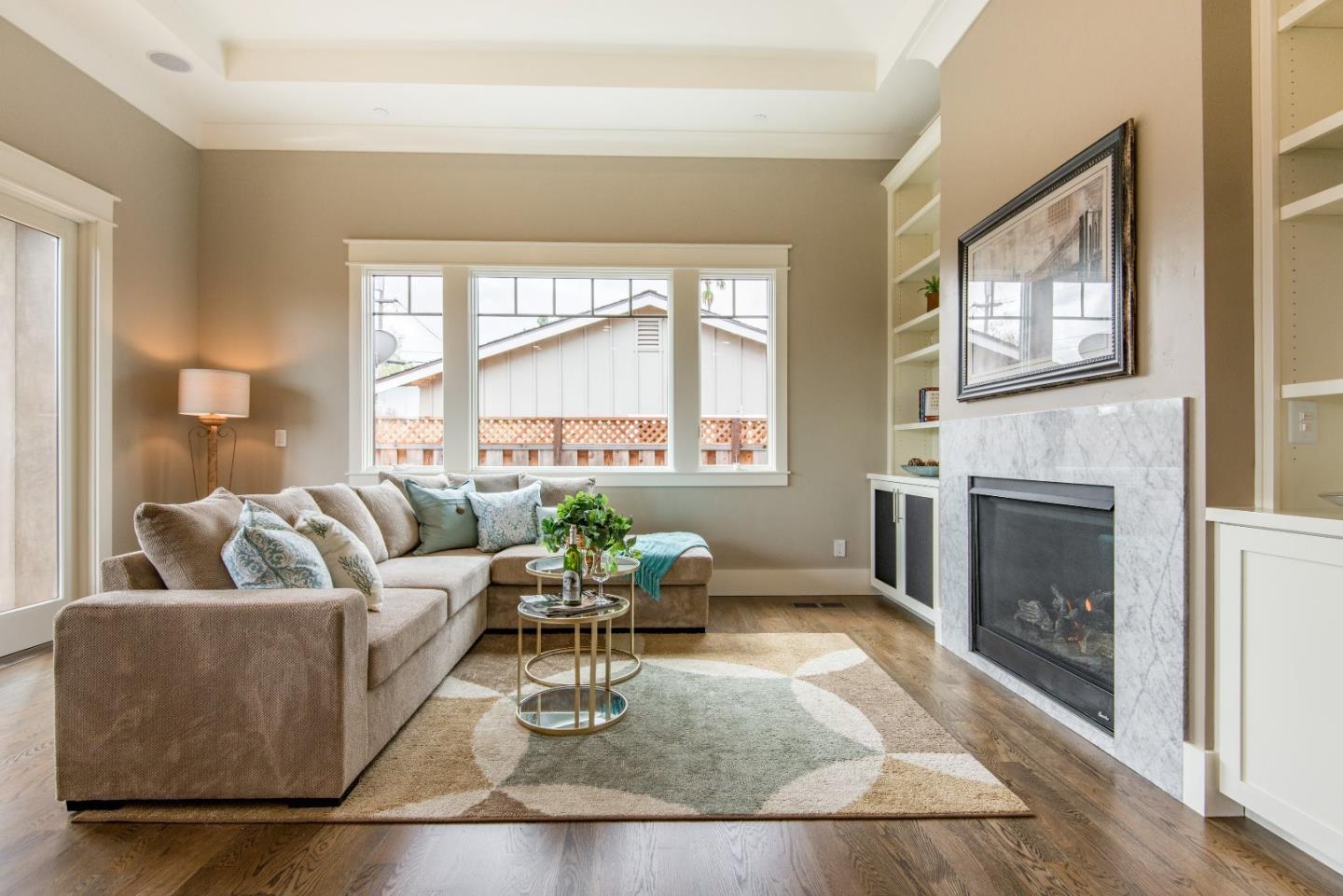 10416 Prune Tree Lane Cupertino, CA 95014 - Photo 8 of 21 a living room with furniture and a fireplace