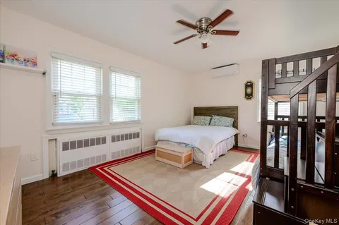 a bedroom with furniture and a window