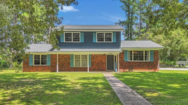 front view of a house with a yard