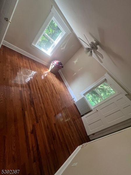 49 Wertsville Road, Unit C Hillsborough, NJ 08844 - Photo 14 of 19 a view of a room with wooden floor and a window