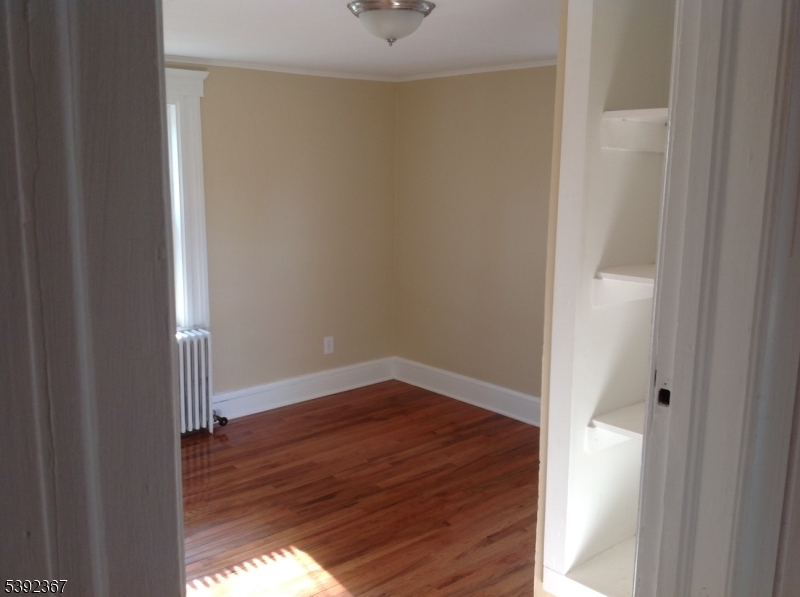 49 Wertsville Road, Unit C Hillsborough, NJ 08844 - Photo 16 of 19 a view of a hallway with wooden floor
