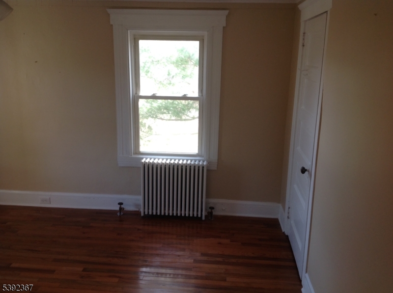 49 Wertsville Road, Unit C Hillsborough, NJ 08844 - Photo 18 of 19 a view of a room with wooden floor and a window