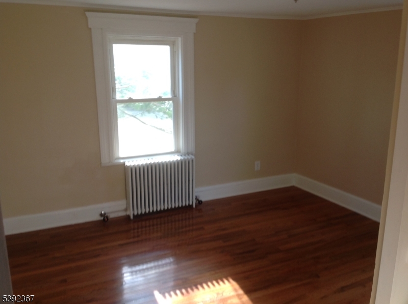 49 Wertsville Road, Unit C Hillsborough, NJ 08844 - Photo 19 of 19 a view of a room with wooden floor and a window