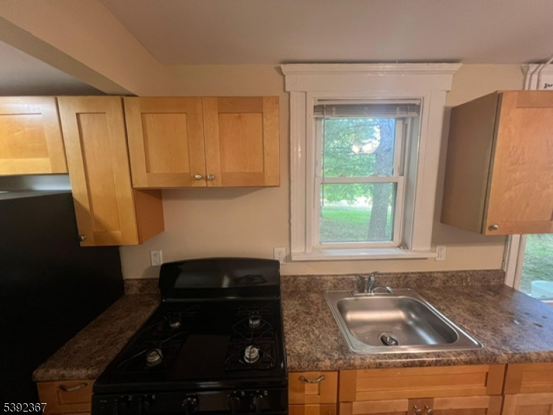 49 Wertsville Road, Unit C Hillsborough, NJ 08844 - Photo 3 of 19 a kitchen with granite countertop a sink stainless steel appliances and cabinets