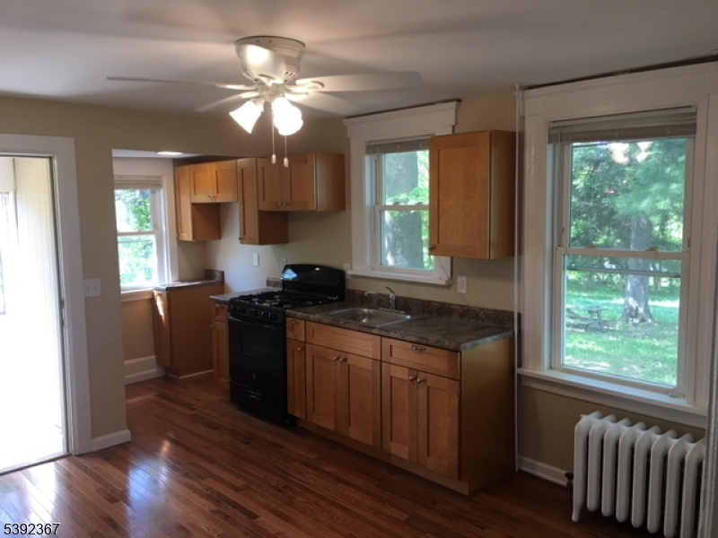 49 Wertsville Road, Unit C Hillsborough, NJ 08844 - Photo 5 of 19 a kitchen with stainless steel appliances granite countertop a stove a sink and a refrigerator