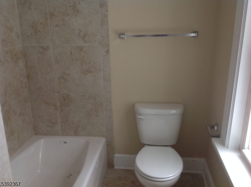 49 Wertsville Road, Unit C Hillsborough, NJ 08844 - Photo 10 of 19 a white toilet sitting next to a bath tub