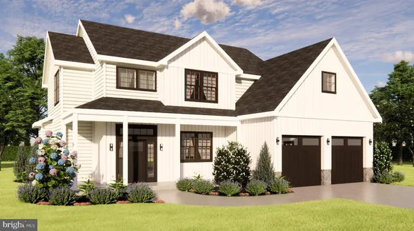 a view of a white house with potted plants and a large tree