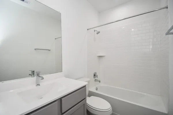 a bathroom with a sink a toilet and a bathtub
