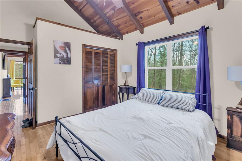 112 Old Stagecoach Road Clarkesville, GA 30523 - Photo 24 of 39 a bedroom with a large bed and a window