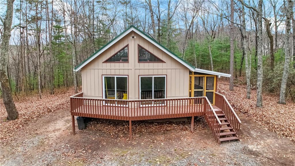 112 Old Stagecoach Road Clarkesville, GA 30523 - Photo 4 of 39 a view of a small house with a yard deck and furniture