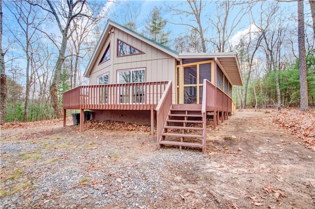 112 Old Stagecoach Road Clarkesville, GA 30523 - Photo 5 of 39 a view of a house with a yard and deck