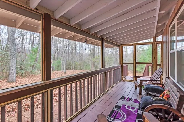 a view of living room with furniture and floor to ceiling window