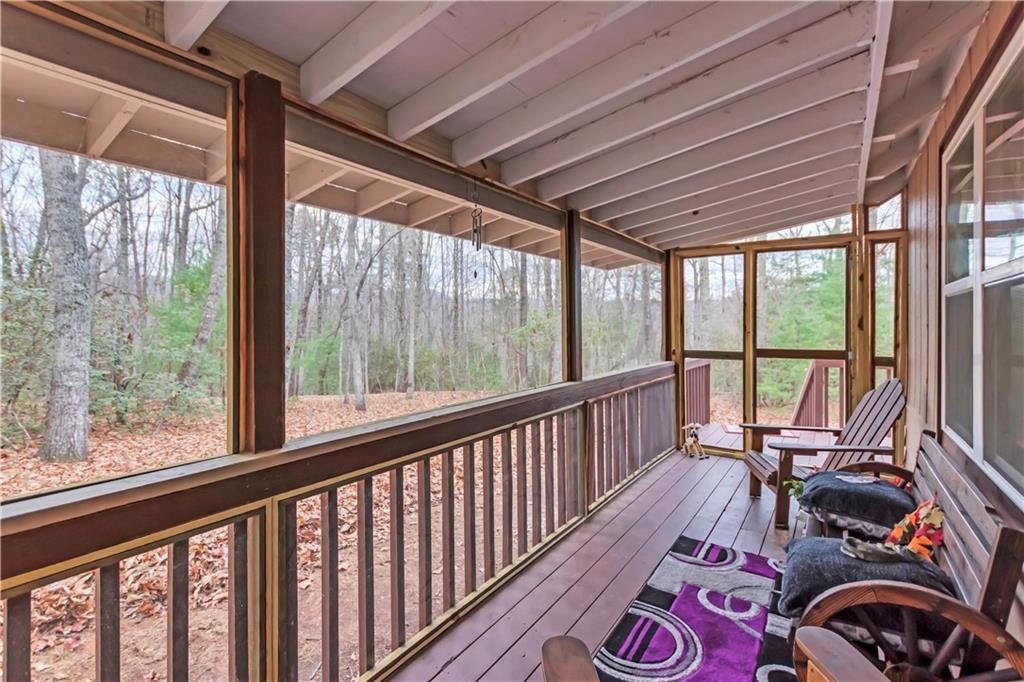 112 Old Stagecoach Road Clarkesville, GA 30523 - Photo 9 of 39 a view of living room with furniture and floor to ceiling window