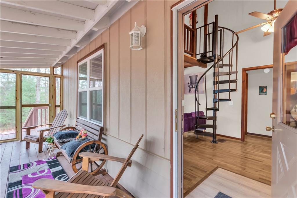 112 Old Stagecoach Road Clarkesville, GA 30523 - Photo 10 of 39 a view of a livingroom with furniture and floor to ceiling window