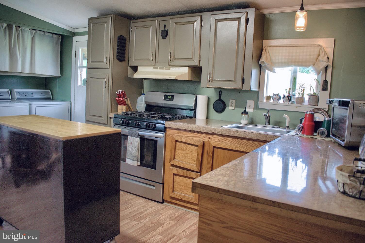 202 T786 Stillwater, PA 17878 - Photo 8 of 29 a kitchen with stainless steel appliances granite countertop a sink stove and refrigerator