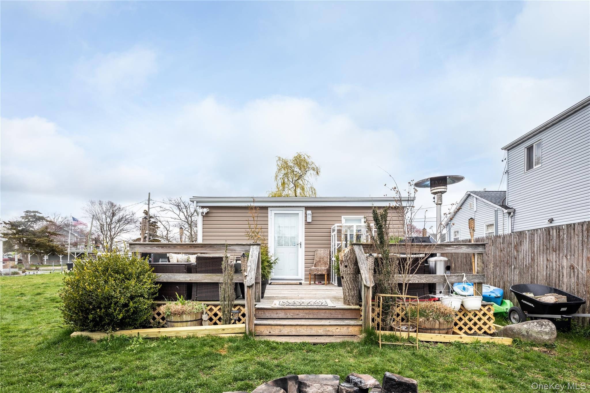 24 Blue Point Road Mastic Beach, NY 11951 - Photo 4 of 16 a view of house with outdoor space and porch