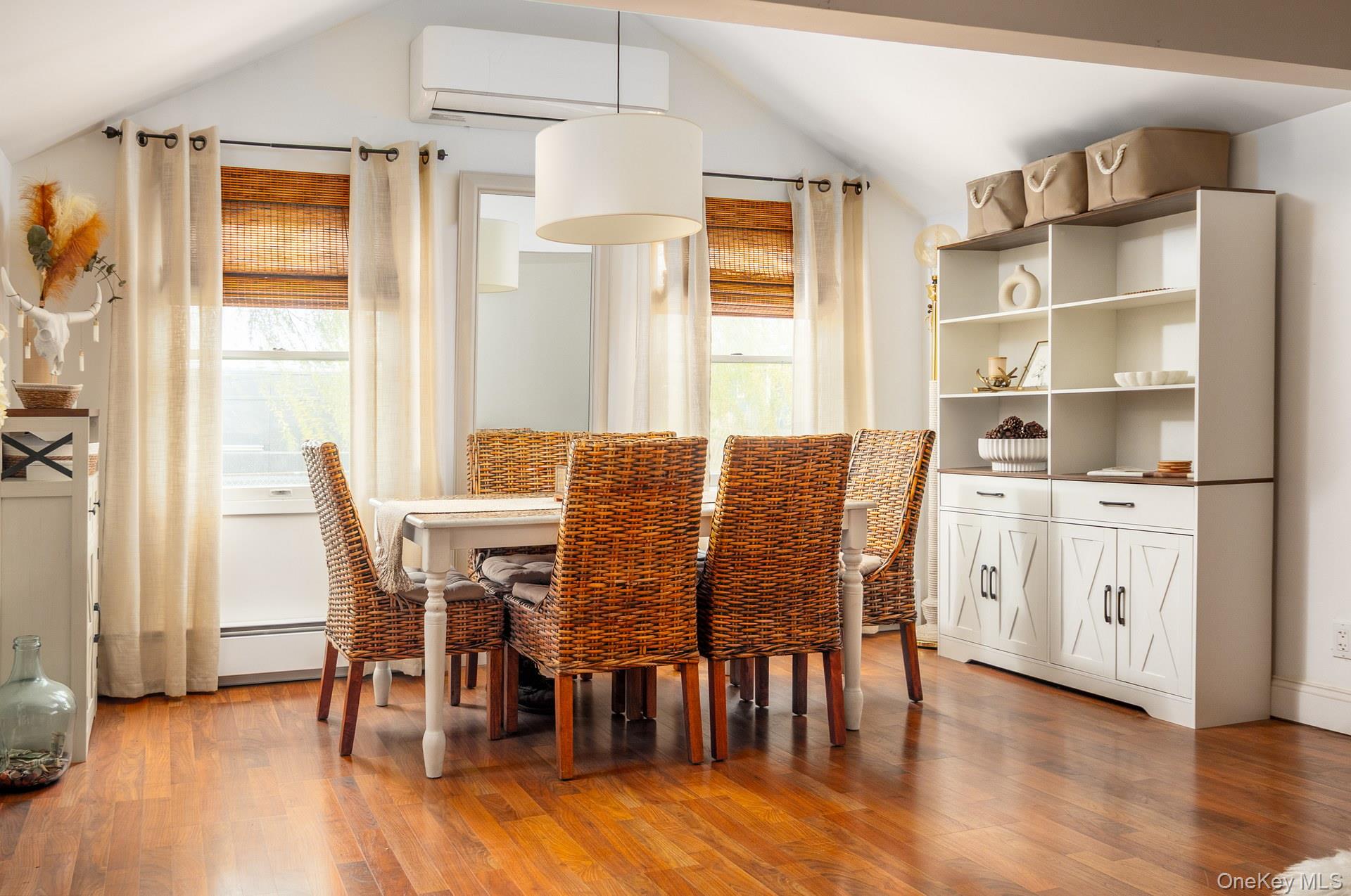 24 Blue Point Road Mastic Beach, NY 11951 - Photo 8 of 16 a view of a dining room with furniture and wooden floor