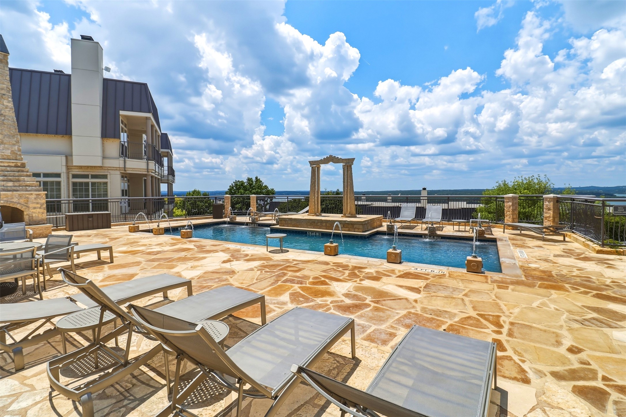 2918 Ranch Road 620, Unit 265 Austin, TX 78734 - Photo 26 of 40 Pool and jacuzzy steps away from the unit. A resort-style pool deck with panoramic views, perfect to enjoy every day.