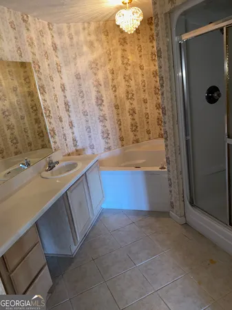 a bathroom with a bathtub and shower