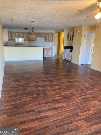 a view of kitchen and kitchen with wooden floor
