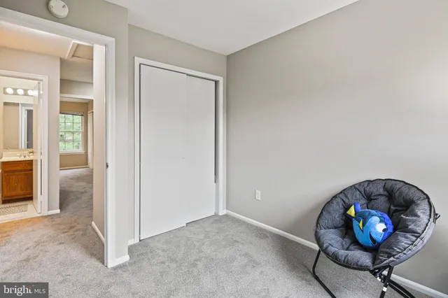 an empty room with wooden floor and entryway