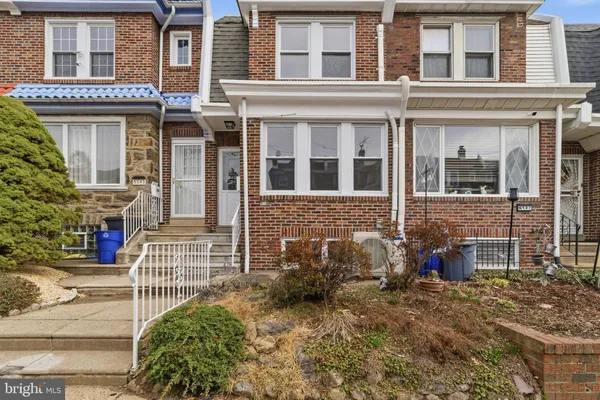 front view of a brick house with a window