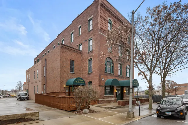 a view of living room with furniture and wooden floor