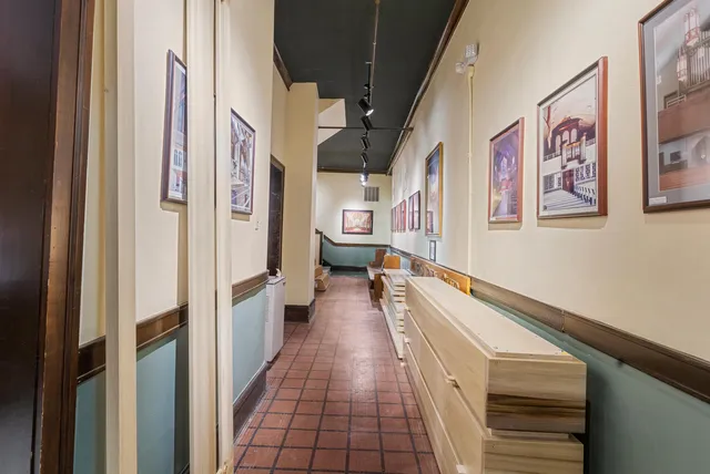 a kitchen with stainless steel appliances granite countertop a stove a sink dishwasher and cabinets with wooden floor