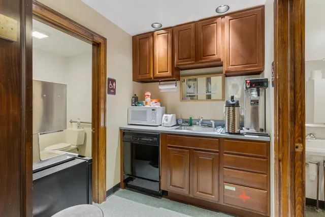 a view of a livingroom with furniture and a window