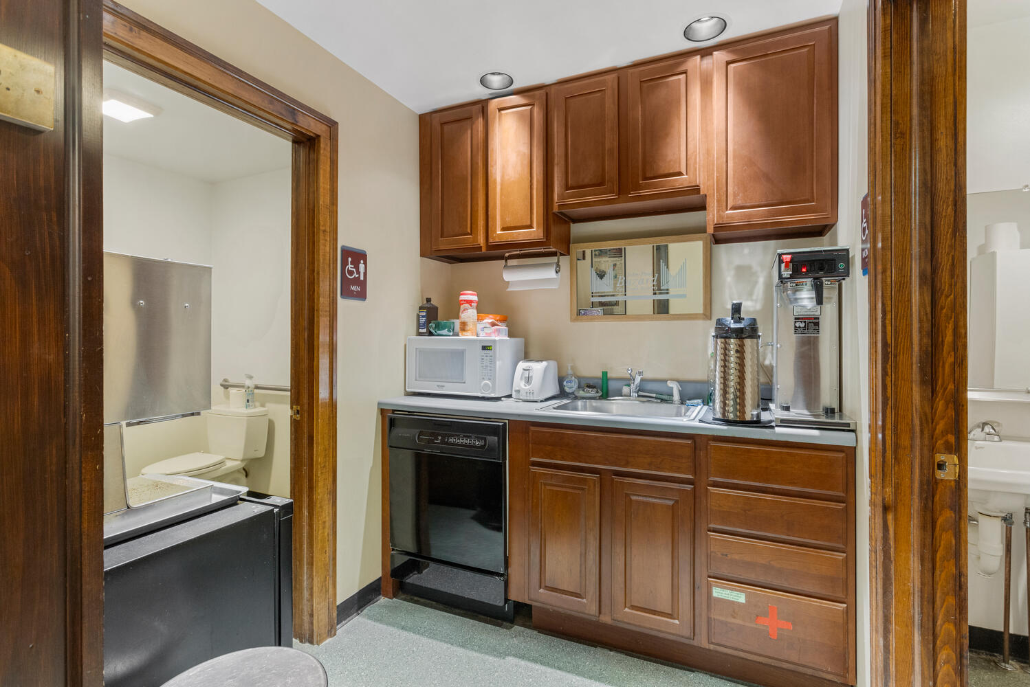 112 West Hill Street Champaign, IL 61820 - Photo 19 of 72 a kitchen with granite countertop wooden cabinets and a stainless steel appliances