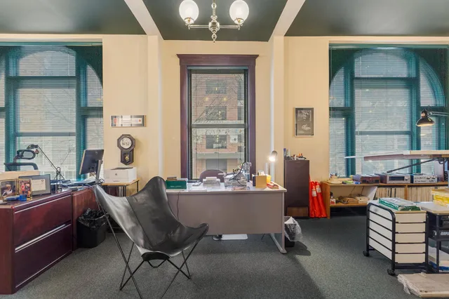 a bathroom with a toilet sink and shower