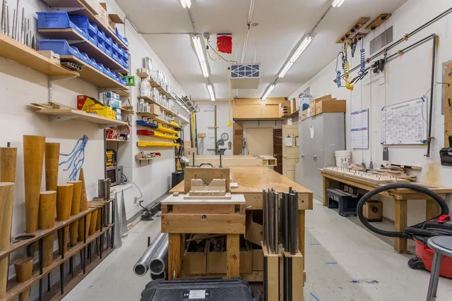 a bathroom with a sink mirror and toilet
