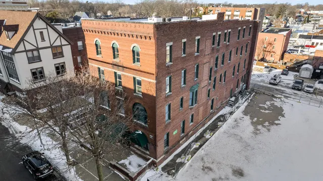 a view of a brick building with a large windows