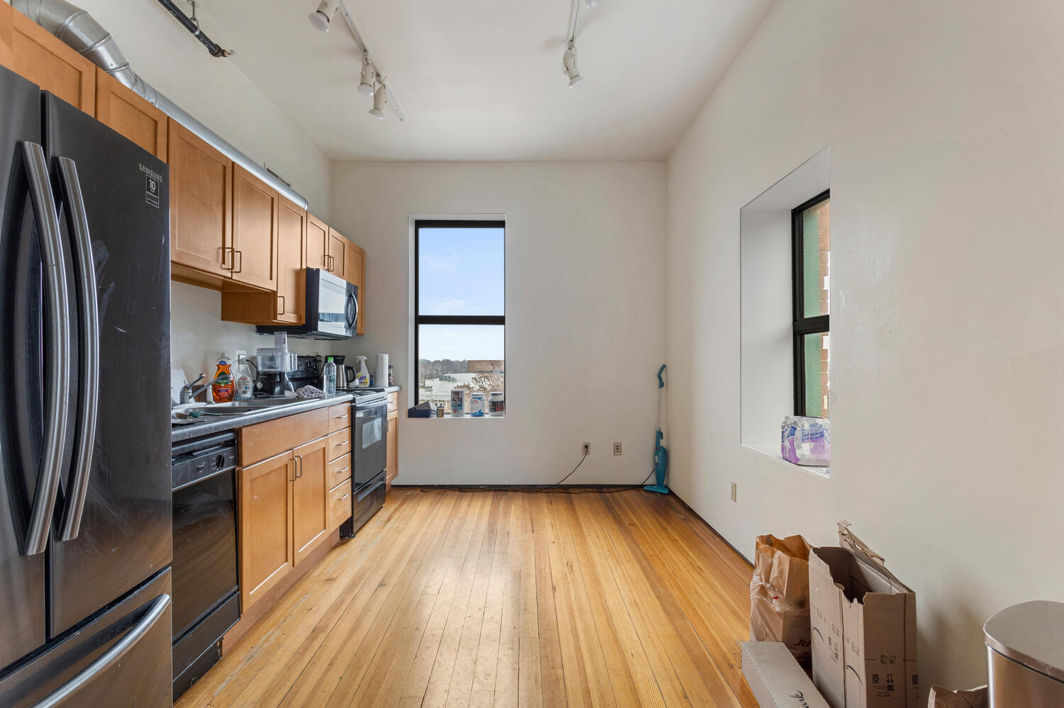 112 West Hill Street Champaign, IL 61820 - Photo 66 of 72 a kitchen with a refrigerator wooden floor and a window
