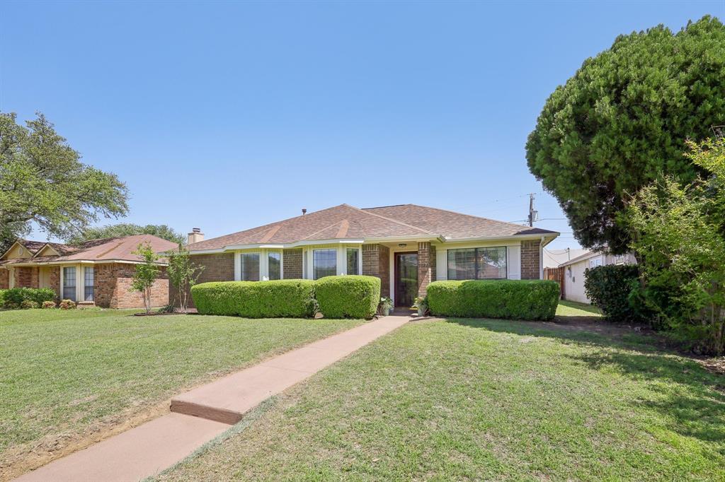 5226 Freestone Circle Dallas, TX 75227 - Photo 1 of 1 Ranch-style home with brick siding and a front lawn