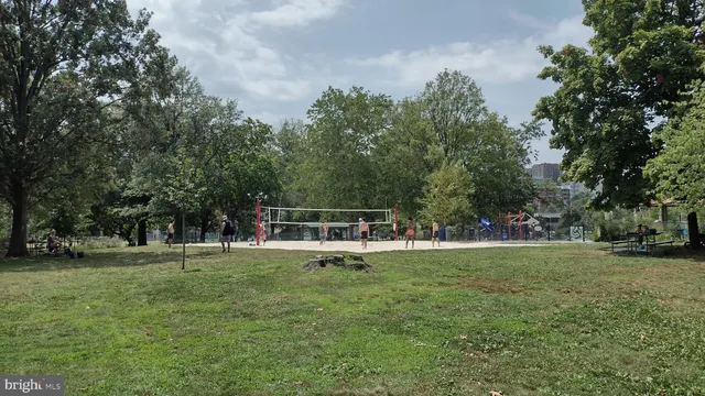 a front view of a building with parking space