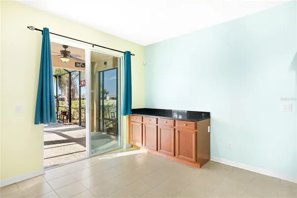 a view of an empty room with glass door