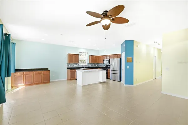 a view of kitchen with cabinets and stainless steel appliances