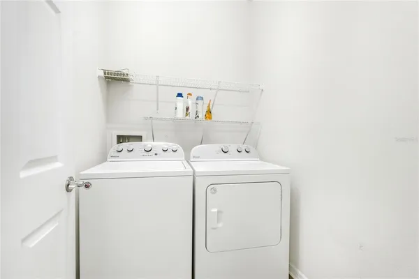 a utility room with dryer and washer