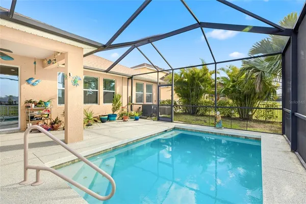 a view of a swimming pool and a yard