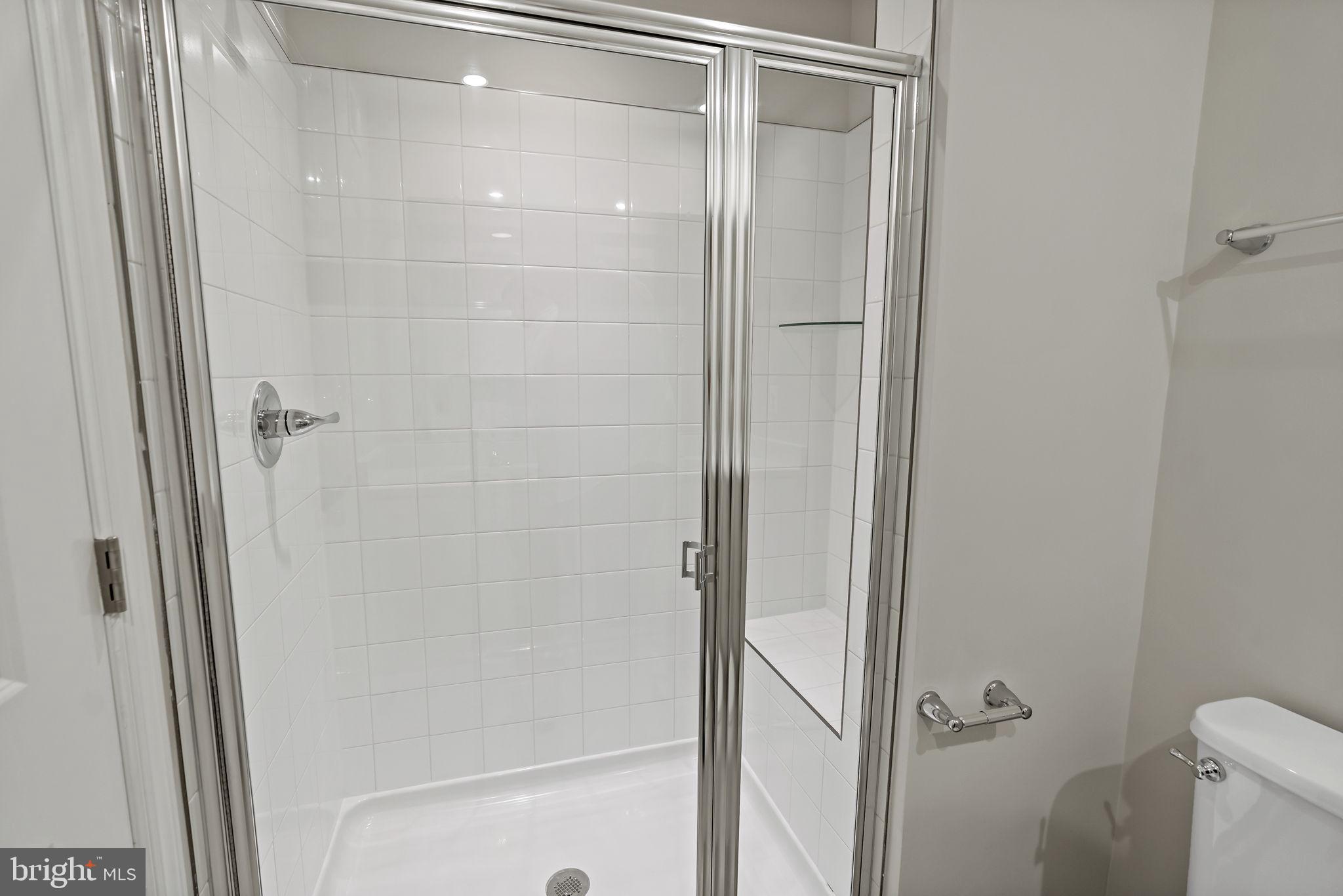 214 Monteith Drive Winchester, VA 22601 - Photo 18 of 31 a bathroom with a glass shower door