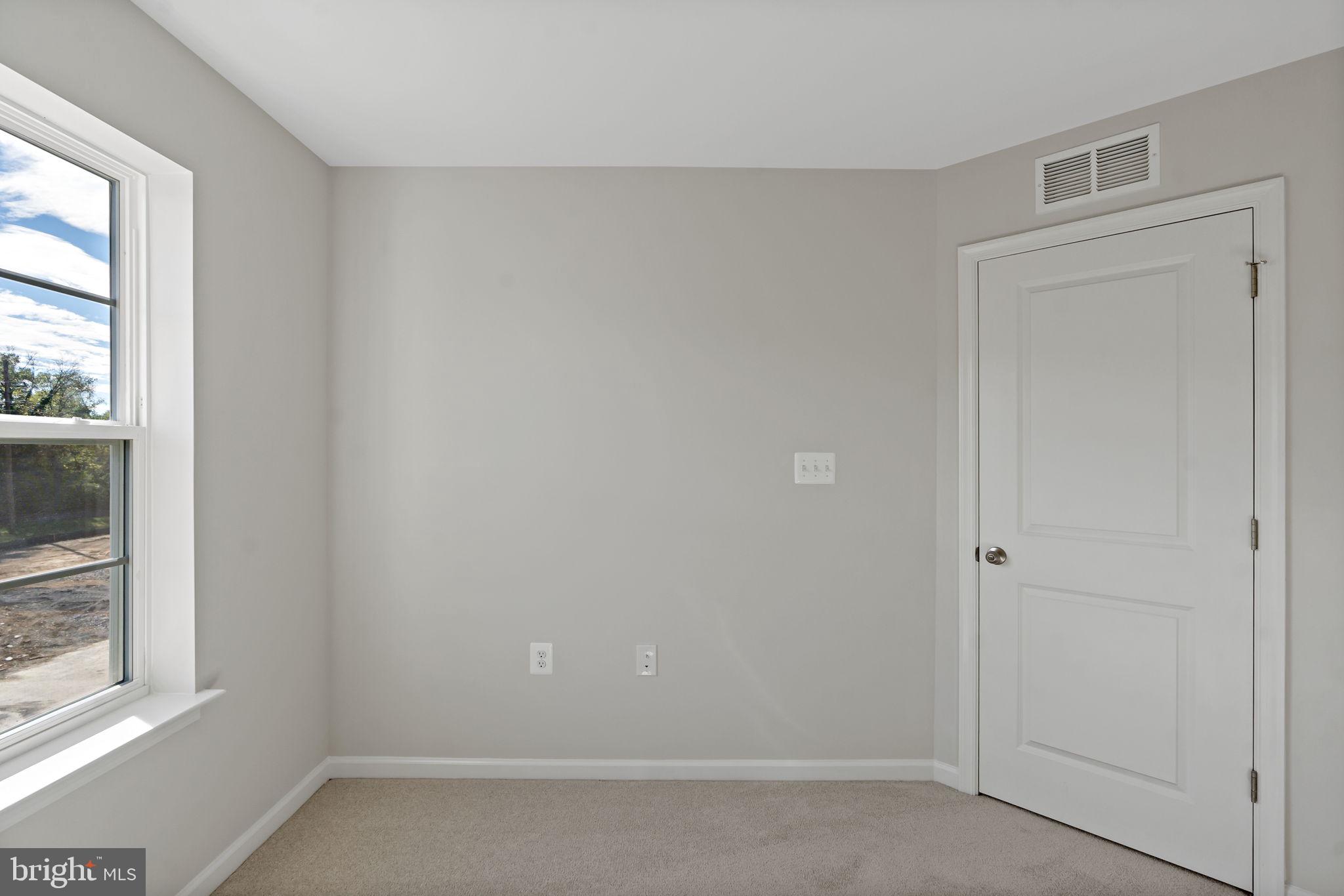 214 Monteith Drive Winchester, VA 22601 - Photo 21 of 31 an empty room with a window