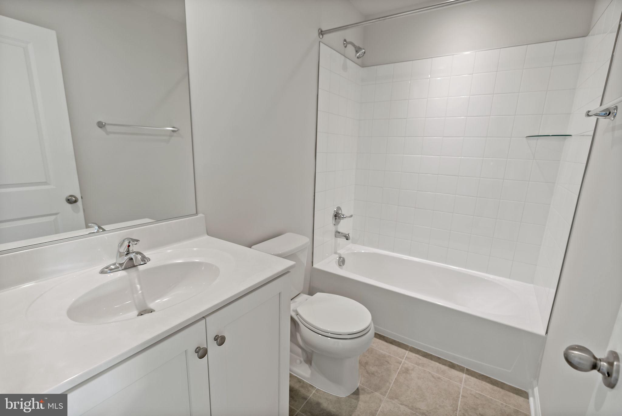 214 Monteith Drive Winchester, VA 22601 - Photo 22 of 31 a bathroom with a sink a toilet and shower