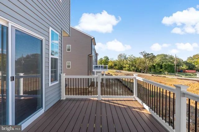 a view of a balcony with wooden floor