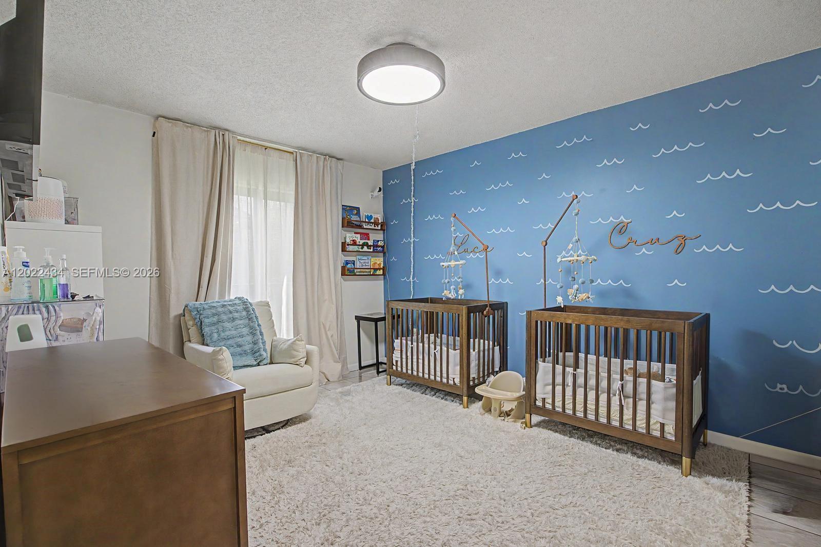 13045 Southwest 68th Street, Unit 111 Miami, FL 33183 - Photo 13 of 15 a living room with furniture and a table