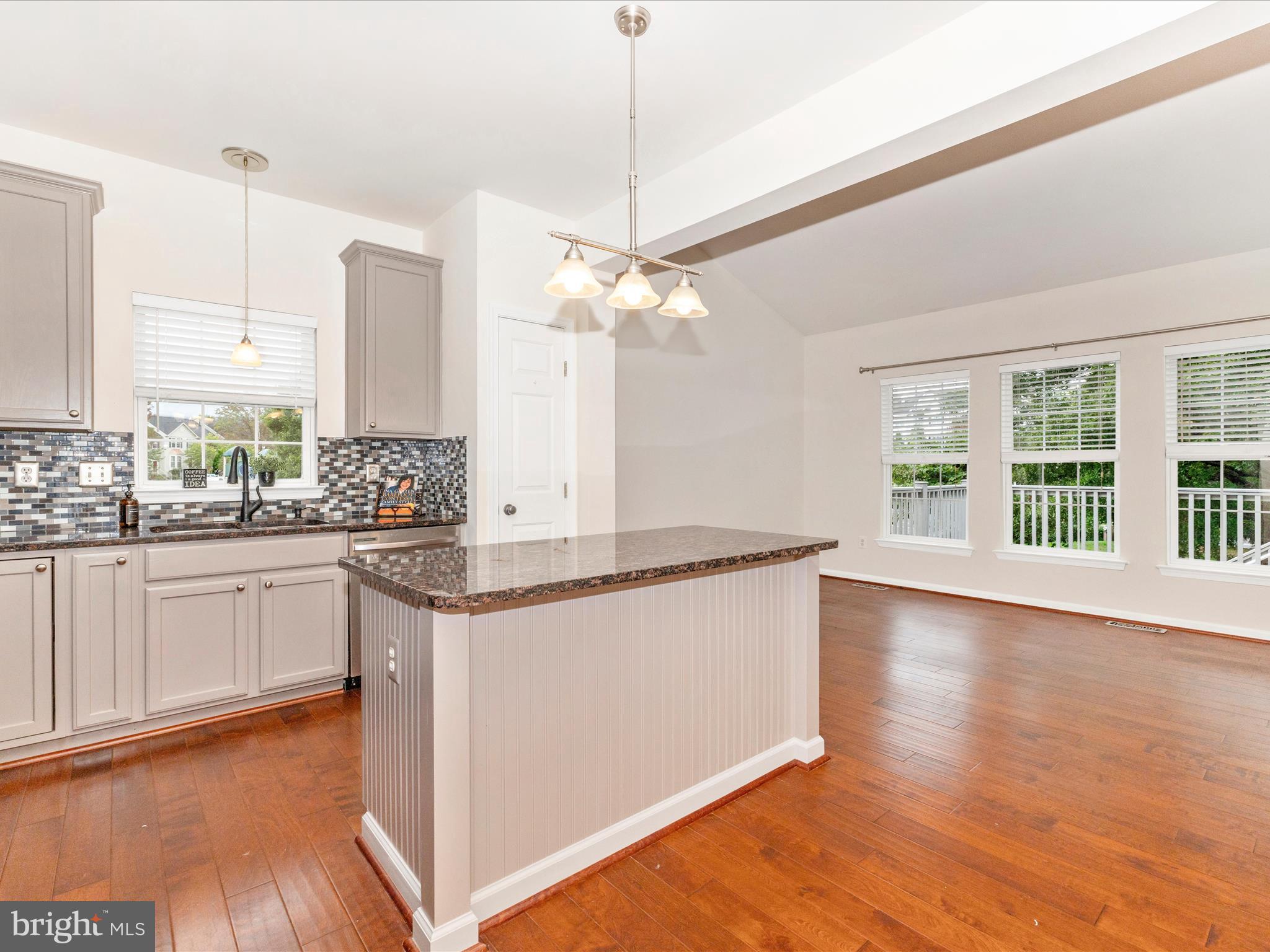 1801 Free Terrace Frederick, MD 21702 - Photo 11 of 62 a kitchen with stainless steel appliances granite countertop a stove a sink and a wooden floors