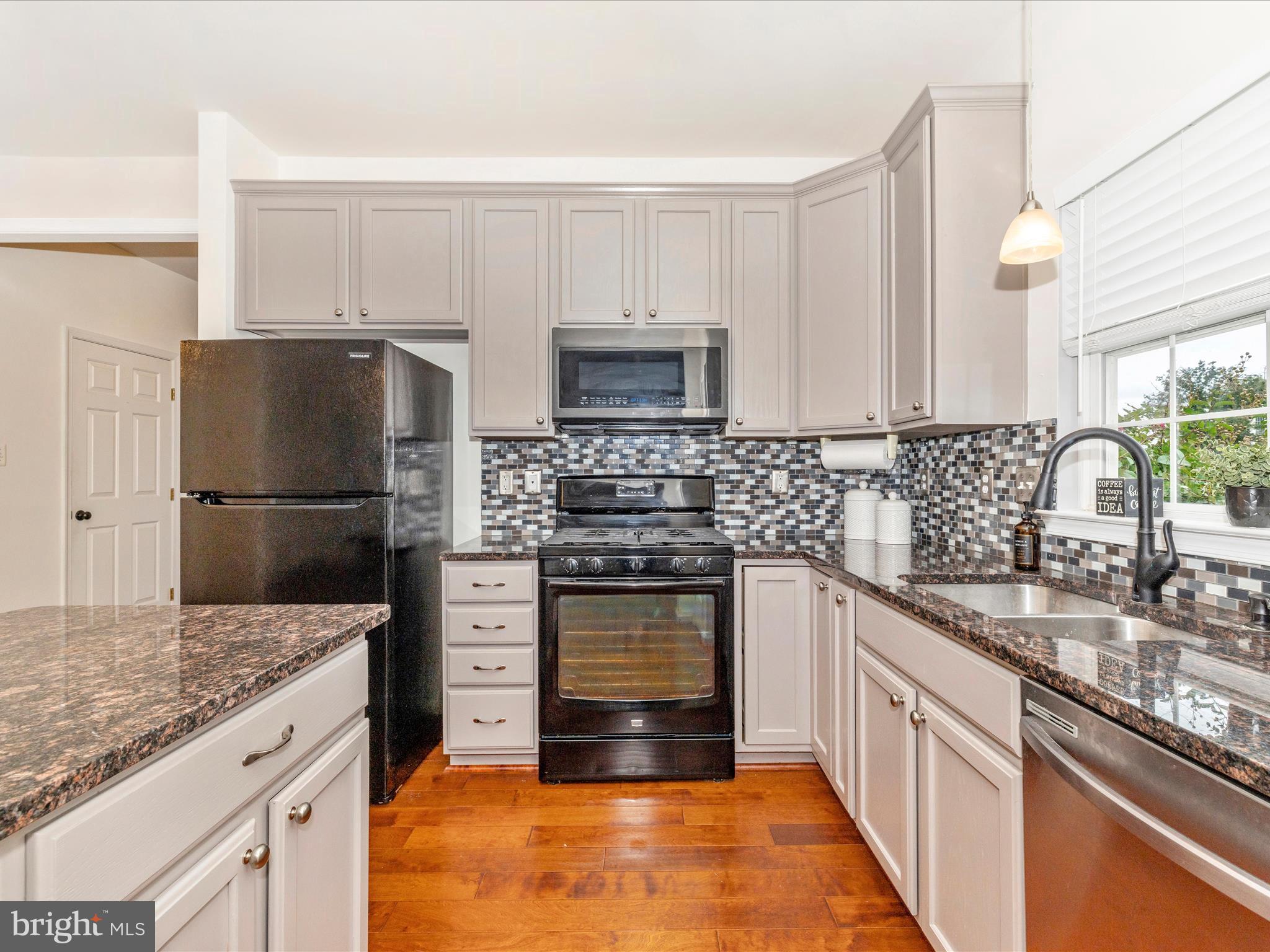 1801 Free Terrace Frederick, MD 21702 - Photo 15 of 62 a kitchen with a sink stove and refrigerator