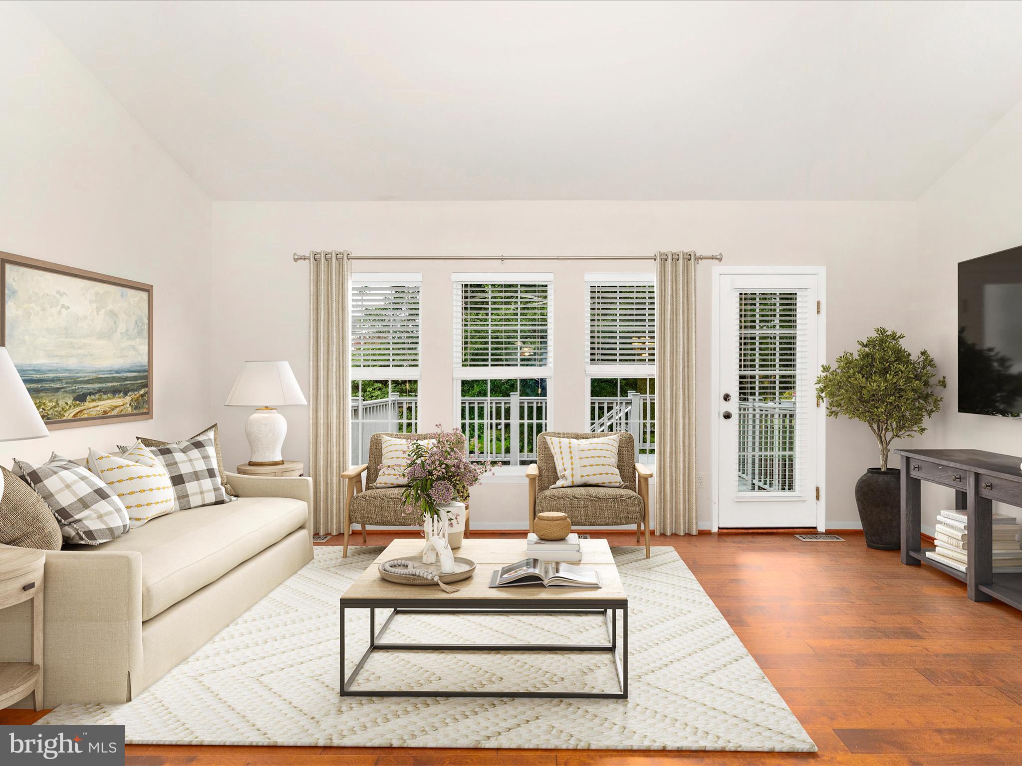 1801 Free Terrace Frederick, MD 21702 - Photo 17 of 62 a living room with furniture large windows and a table